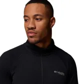 Polar Columbia Titanium modelo Driventure Half Zip, color negro, de manga larga con cierre frontal medio y orificios para los pulgares en los puños. Confeccionado con tecnologías Omni-Wick para absorción de humedad y Omni-Shade con protección solar UPF 50.
