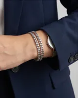 Pulsera de eslabones tipo cubana en acero inoxidable, con diseño clásico y acabado brillante.