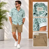 Camisa de manga corta de la marca Duron Originals, color verde con estampado de hojas blancas. Cuenta con cuello camisero, cierre frontal de botones y detalles de vuelta en las mangas.