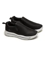 Zapatillas slip-on negras con suela blanca.