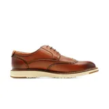 Zapatos de vestir Hanker de cuero marrón con diseño tipo brogue y suela blanca dentada.