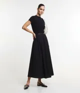Blusa de punto texturizado color celeste, de manga corta y cuello alto, marca Cortelle.