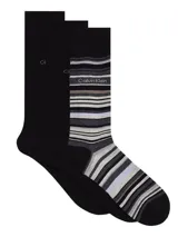Pack de tres pares de medias largas Calvin Klein, incluye dos pares negros lisos con logo CK y un par a rayas horizontales en tonos grises con logo Calvin Klein.
