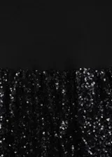 Vestido corto con cuerpo entallado sin mangas y cuello redondo, combinado con una falda estilo globo con acabado de lentejuelas brillantes.