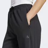 Pantalón deportivo Adidas Designed For Training Warm-Up color negro, con ajuste holgado, cintura elástica con cordón, bolsillos frontales con cierre, puños elásticos y tecnología Climacool.