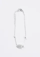 Pulsera de plata 925 con cadena de eslabones finos y pequeñas bolitas plateadas intercaladas. El dije central es un cuadrado engastado con circonias brillantes.