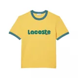 Remera Lacoste de algodón color amarillo con cuello y bordes de mangas en color verde petróleo. Presenta el logo de la marca estampado en el frente en letras grandes de color verde.