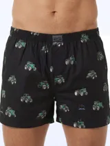 Bóxer negro de algodón liviano, con cintura elastizada y estampado integral de pequeños tractores verdes.