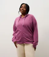 Campera deportiva de modal color gris melange, con cierre frontal por cremallera, capucha ajustable con cordones, mangas largas con puños ajustados y bolsillo tipo canguro.