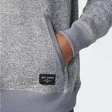 Canguro Rip Curl Crescent Hood de tejido melange gris, con capucha ajustable por cordones crudos con topes de PU, bolsillo tipo canguro frontal con ribetes y etiqueta tejida de la marca.