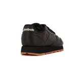 Championes Reebok Classic Leather negros con suela de goma color caramelo.