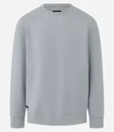 Buzo deportivo color verde claro, de manga larga y cuello redondo. Confeccionado en tejido de poliéster, viscosa y elastano.