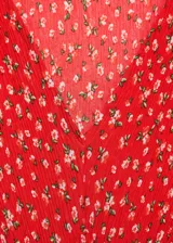 Vestido midi de corte recto con estampado floral, cuello en pico y mangas cortas. Presenta una abertura lateral en la falda y cierre de cremallera lateral.