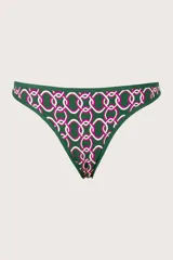 Calzón de bikini verde oscuro con estampado geométrico de círculos blancos y rosas. Tiene corte a la cadera, cobertura chica y ribete verde.