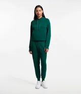 Pantalón jogger deportivo color verde oscuro, con cintura elástica y lazo ajustable, bolsillos laterales y bajo ajustado.