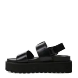 Sandalias de mujer Miss Carol color negro, con base plataforma flatform y suela dentada. Posee dos tiras anchas en el empeine, hebilla metálica grande y tira trasera con velcro.