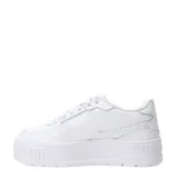 Championes urbanos Puma modelo Karmen II Idol, color blanco, con plataforma alta y diseño de corte bajo. Presentan el logo de la marca en el lateral y lengüeta.