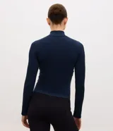 Campera deportiva Get Over de corte ajustado, color marrón, confeccionada en poliamida y elastano con textura acanalada, cuello alto y cierre frontal por cremallera.
