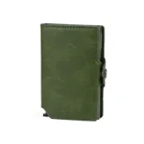 Billetera compacta de cuero verde con mecanismo de eyección de tarjetas y cierre a presión. Presenta el nombre "BALEINE" grabado en la parte inferior frontal.