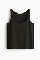 Musculosa cropped de punto suave de algodón, color negro, con escote en U y corte holgado.