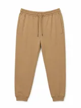 Pantalón de jogging marrón tostado, de corte relajado, con cintura elástica con cordón de ajuste, bolsillos laterales y puños en los tobillos.