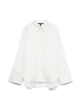 Camisa de manga larga con cuello clásico y puños anchos, de calce regular y diseño versátil. Presenta cierre frontal de botones y está confeccionada en tejido plano de tacto suave.