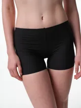 Culotte de microfibra color beige, de tiro medio y diseño sin costuras laterales, con refuerzo de algodón en el fundillo.