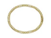 Pulsera esclava rígida con diseño de cuentas esféricas y cilindros intercalados, con acabado en baño de oro.