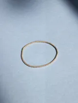 Pulsera elástica de cuentas de 2mm en oro laminado 14 Kilates (Goldfilled).