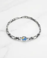 Pulsera de eslabones de acero antialérgico con dije central circular esmaltado con la bandera de Uruguay.
