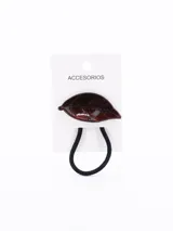 Colero para el pelo con aplique decorativo en forma de hoja de color marrón con acabado brillante y destellos.