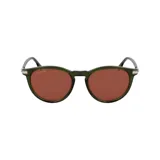 Lentes de sol Lacoste, con montura redonda color verde y detalles plateados en los laterales.