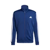 Conjunto deportivo Adidas Dayready Basic de tres tiras, color azul, compuesto por una campera de cierre frontal con cuello alto y un pantalón de jogging con bolsillos. Ambos elementos cuentan con las icónicas tres líneas blancas de la marca en los laterales y el logo estampado en el pecho y la pierna.