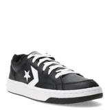 Championes Converse modelo Pro Blaze V2 OX, de corte bajo, color negro con detalles en blanco. Presentan el logo de estrella y chevron característico de la marca en el lateral, con cierre de cordones y suela de goma blanca.