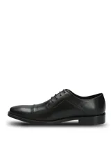 Zapato de vestir formal Hush Puppies modelo Jazz Black, confeccionado en cuero negro con diseño clásico acordonado y costura en la puntera.