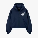 Campera tipo canguro con cierre frontal, color azul marino, de corte holgado y mangas abullonadas con puños ajustados. Presenta un bordado blanco con un monograma estilizado en el pecho.