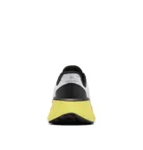 Championes de trail running Columbia modelo Konos Elevate, con diseño estampado en blanco y negro, entresuela de espuma color amarillo vibrante y suela de alta tracción.