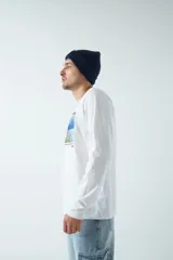 Remera negra de manga larga con estampa de pintura impresionista en el frente y texto 'Impression - Sunrise'.