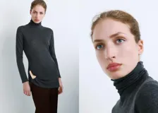 Jersey de cuello alto gris oscuro, de manga larga y corte ajustado.