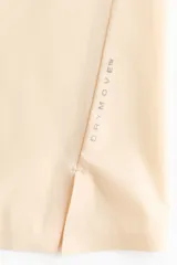 Musculosa deportiva de color beige, confeccionada en tejido funcional con tecnología DryMove para absorber el sudor. Presenta un diseño de corte estándar, cuello redondo y aberturas laterales en el bajo.