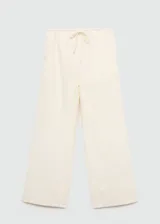 Pantalon wideleg de corte holgado, confeccionado en algodón, con cintura elástica y lazo ajustable.