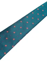 Corbata de seda azul marino con estampado paisley en tonos rosados y blancos.