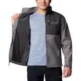 Chaqueta Columbia Ascender Soft Shell con diseño bicolor en tonos gris y gris oscuro. Cuenta con cierre frontal completo, cuello alto con protector de mentón, bolsillo en el pecho con cierre, bolsillos laterales con cierre y puños ajustables con velcro.