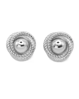 Par de aros tipo stud de acero quirúrgico hipoalergénico color plateado, con diseño vintage de forma circular y centro abultado.