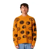 Buzo de tejido de punto color amarillo mostaza con estampado integral de figuras circulares negras. Presenta cuello redondo, puños y ruedo acanalados, con un corte holgado.