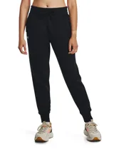 Pantalón tipo jogger de mujer Under Armour, confeccionado en tejido polar de mezcla de algodón con interior cepillado. Presenta cintura elástica con cordón de ajuste exterior, bolsillos laterales abiertos y puños acanalados en los tobillos.