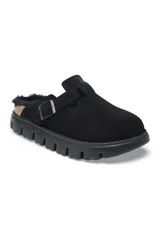 Zueco negro con interior de piel sintética, tira ajustable con hebilla y suela chunky.