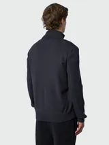 Campera híbrida Moncler con frente acolchado en color azul marino y mangas de tejido de punto en color negro. Presenta cuello alto tejido, cierre frontal completo y bolsillos laterales con cierre. Incluye el logo de la marca en el pecho y en la manga.