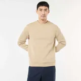 Buzo de cuello redondo en felpa perchada, con diseño liso, mangas largas y puños acanalados.
