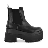 Botas negras de cuero sintético con plataforma y elástico lateral.